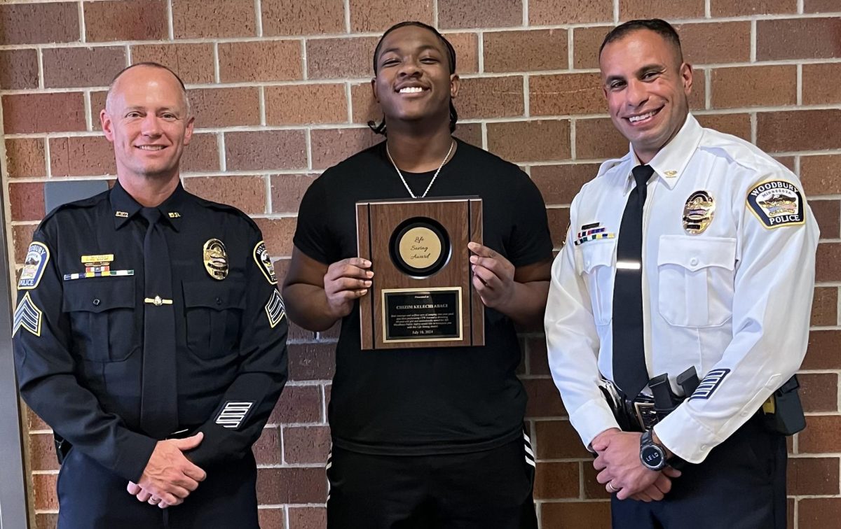 Sgt. Scott Melander, Chizim Abagi and Deputy Chief Omar Maklad