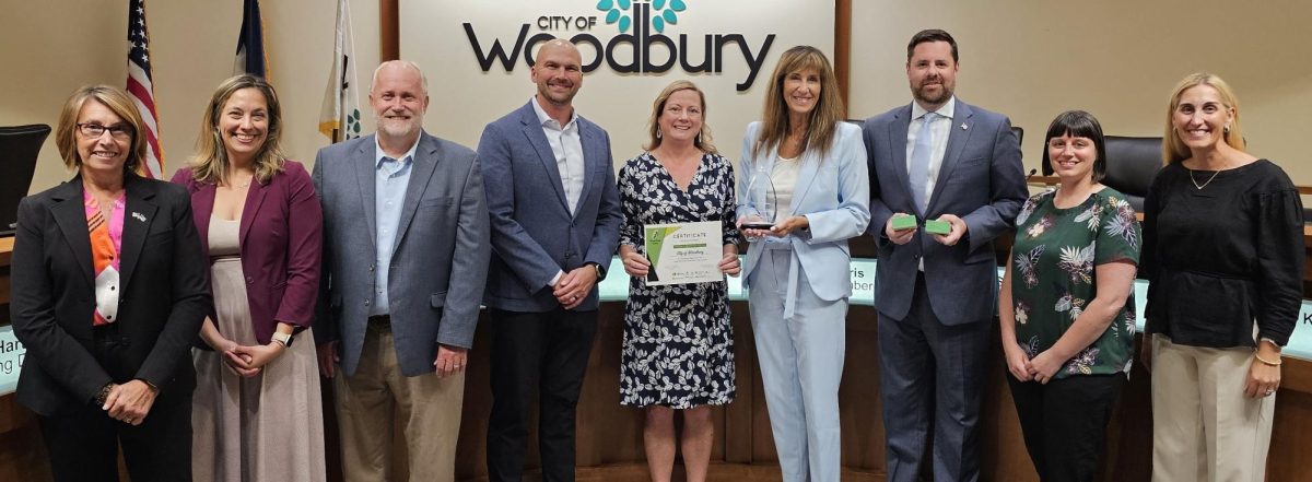 Council Member Kim Wilson, Council Member Andrea Date, Craig Johnson and Luke Fischer with the League, Woodbury Environmental Resources Manager Jennifer McLoughlin, Mayor Anne Burt, Council Member Steve Morris, Kristin Mroz with GreenStep Cities, and Council Member Jennifer Santini.