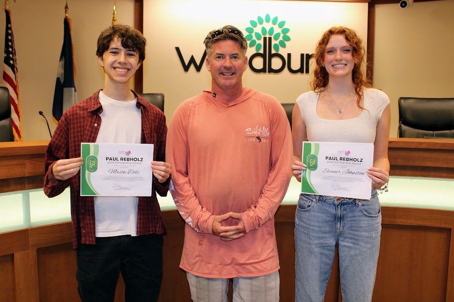 Senior Mason Dols, Matthew Johnson, former President, Woodbury Community Foundation, and Senior Eleanor Johnston