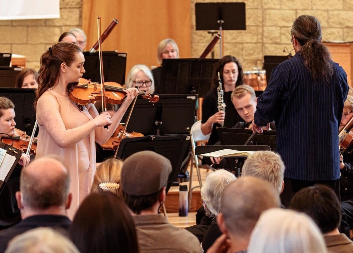 Aja Majkrzak plays violin at a recent East Metro Symphony Orchestra concert. The orchestra’s next concert is Sunday in Woodbury. (Contributed photo)