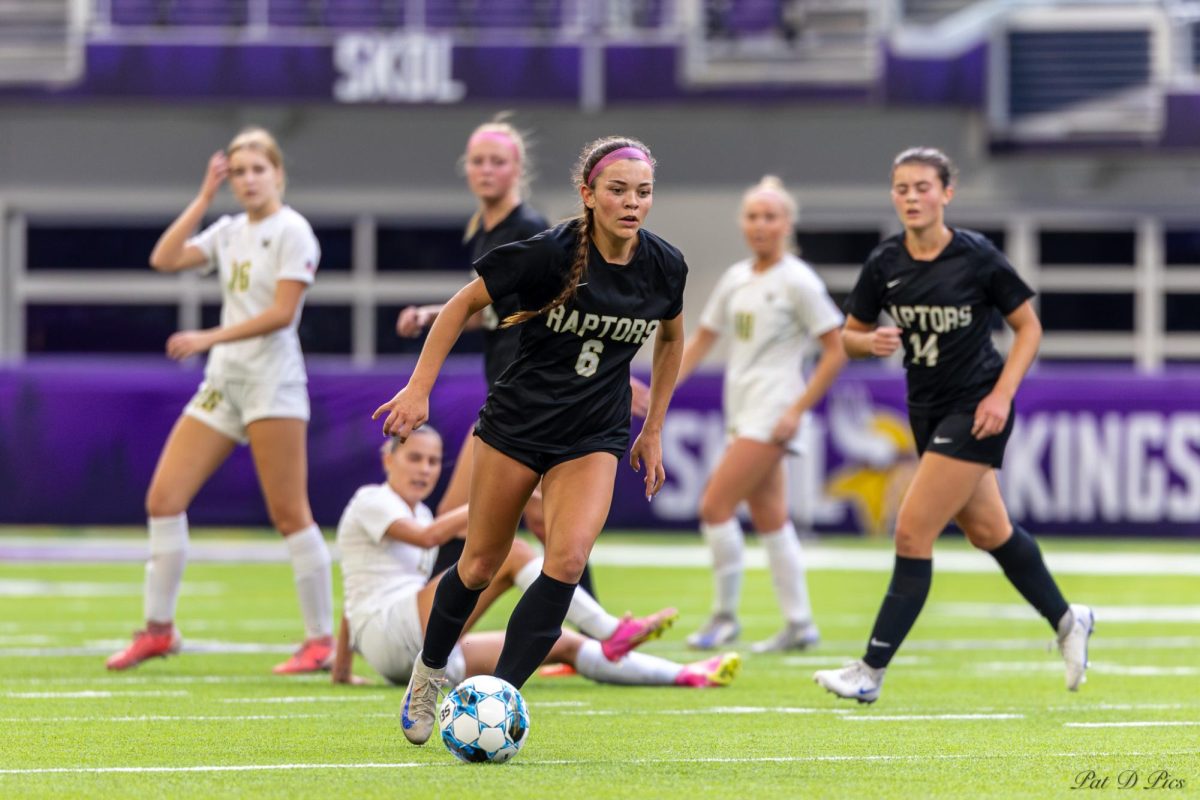 The Raptors’ Kate Murphy in action against Edina in the state semifinal. 