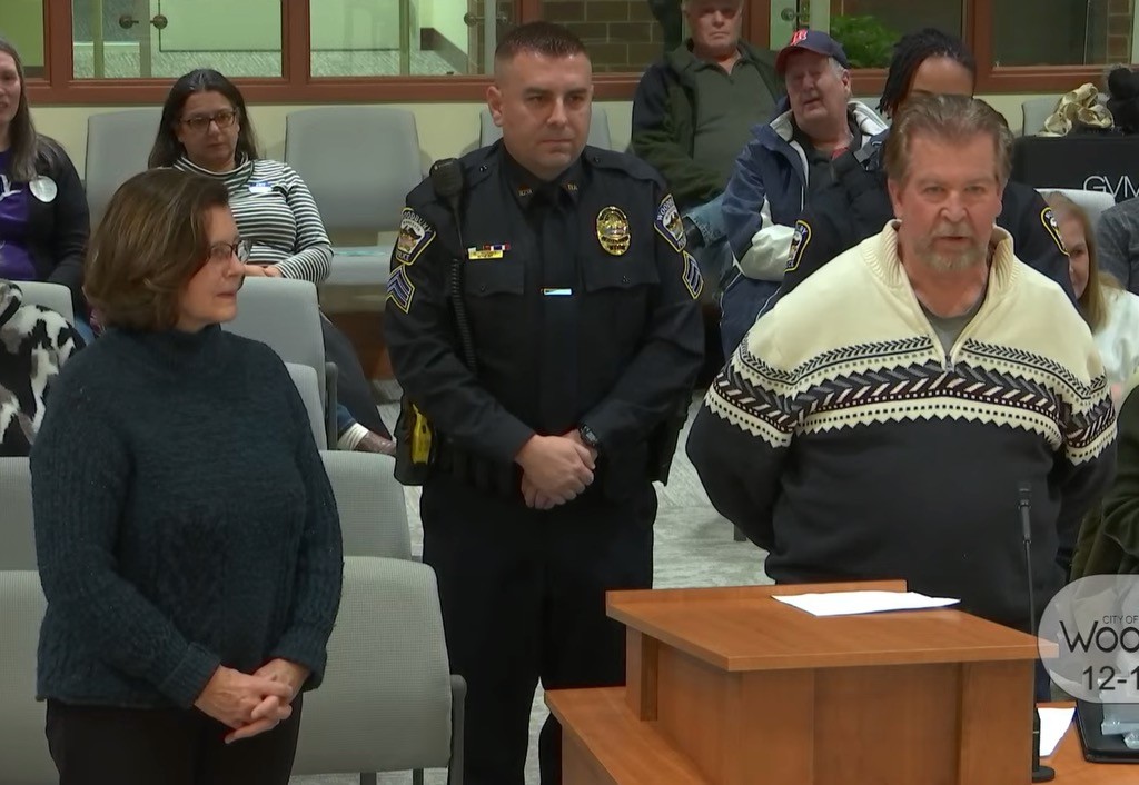 Pamela Khoury and Gregory Uhls appear before the city council to receive Community Lifesaving Awards. Photo: City of Woodbury.