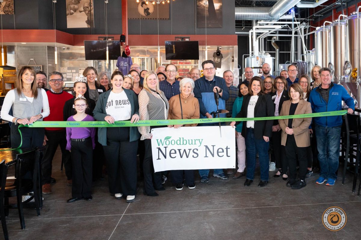 The Woodbury Area Chamber of Commerce hosts a ribbon-cutting for Woodbury News Net.