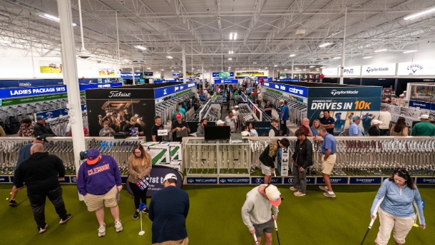 Customers try out the putting green at the grand opening of the PGA TOUR Superstore in Greenville, SC.