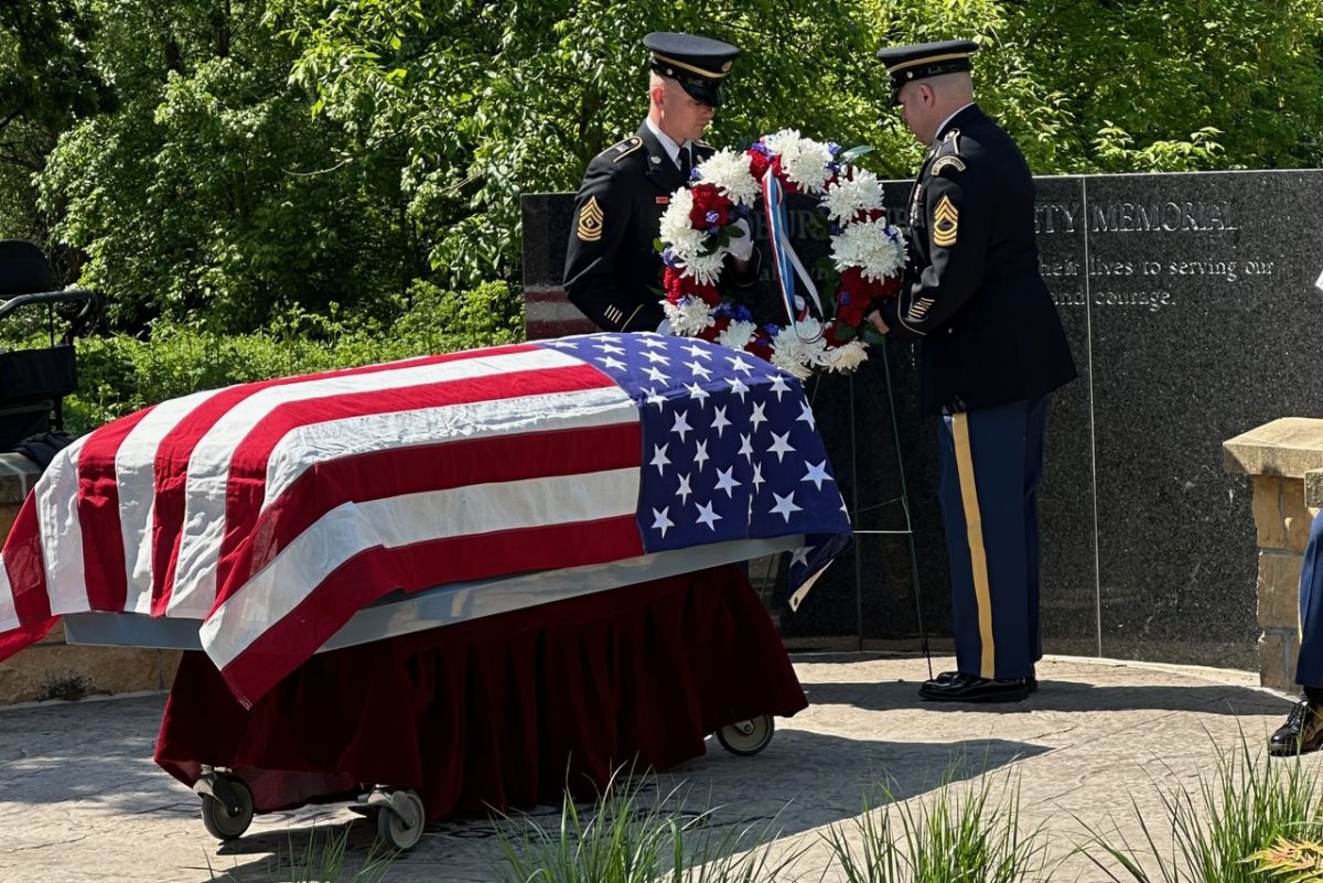 A wreath was placed to honor fallen veterans, including those lost to suicide.