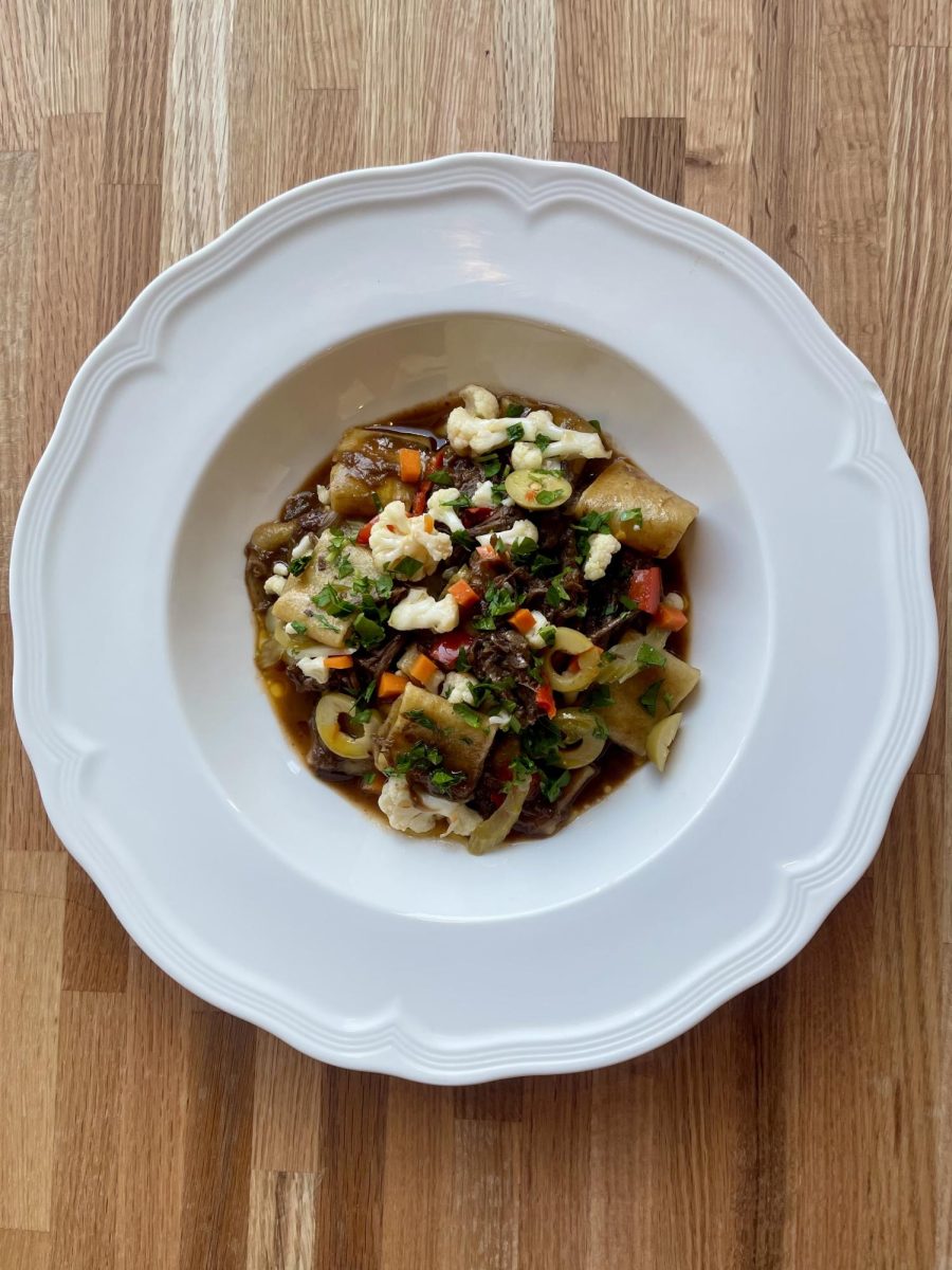 Paccheri pasta with braised beef and housemade giardiniera, served in a rich red wine jus.