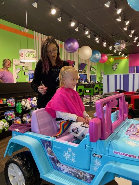 Three-year-old Charlotte Hintz gets Sharkey’s Cuts For Kids’ signature first-class  treatment from stylist Natalie Knauff last week. 

