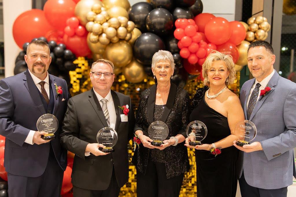 The Greater Woodbury Chamber of Commerce’s award winners for 2025 (from left to right): Kevin Lunch, fire marshal, Opey Peñaloga of Basic Needs, Sandy Peterson, volunteer, Kelly Jahner-Byrne, business owner, and Logan Cartensen, a teacher at Lake Middle School. (Credit/Walters Production Company)