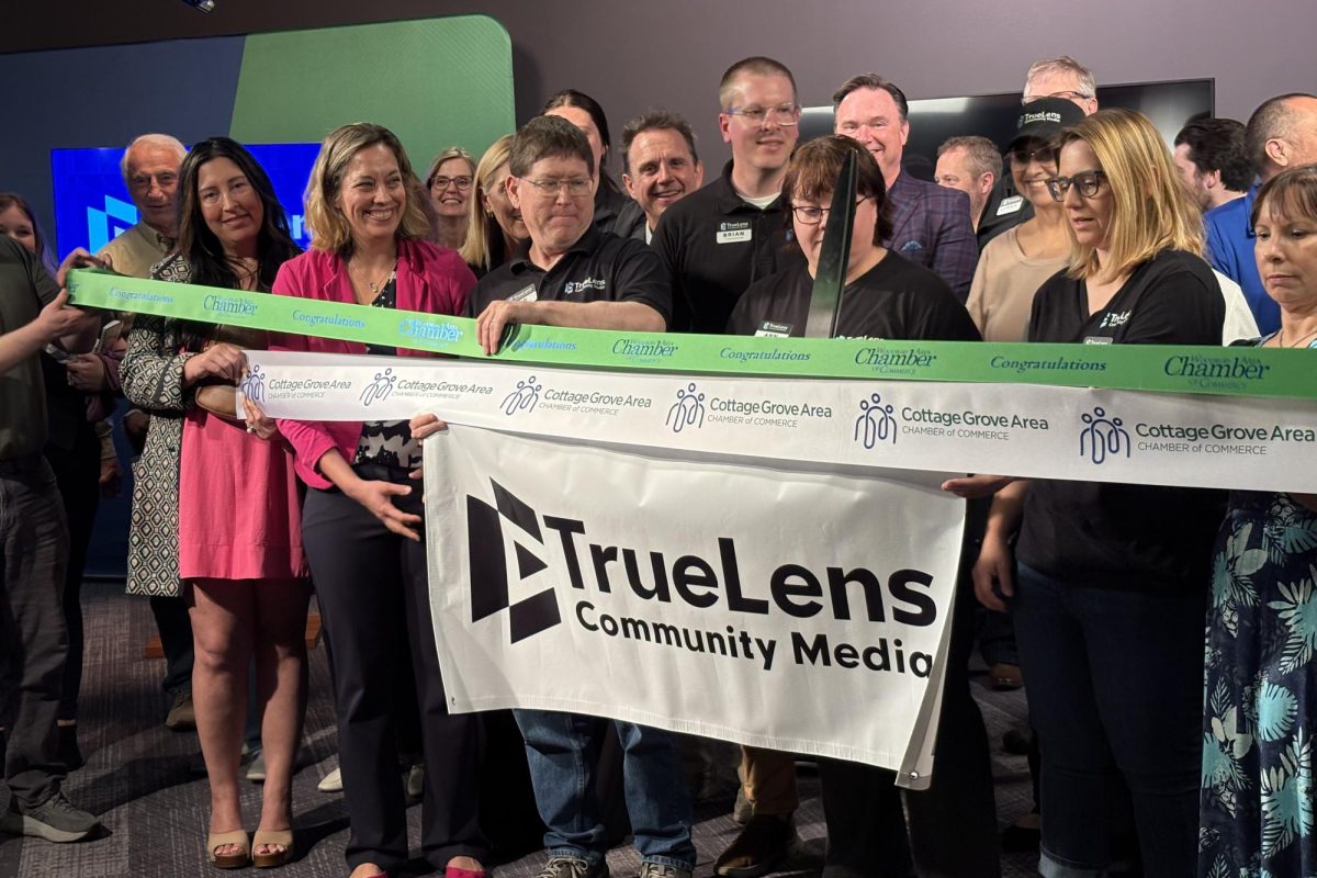 Executive Director Ann Schweisguth with the scissors; to her left, Bob McSherry, multimedia manager for True Lens; and to his left, Andrea Date (in magenta jacket), chair of True Lens Media and former Woodbury City Council member.