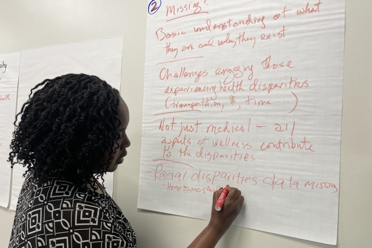 A Woodbury Thrives volunteer jots down ideas on where to direct the foundation's future initiatives.